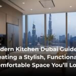 Modern Dubai kitchen interior with handleless cabinets, quartz island, built-in appliances, and soft neutral lighting.
